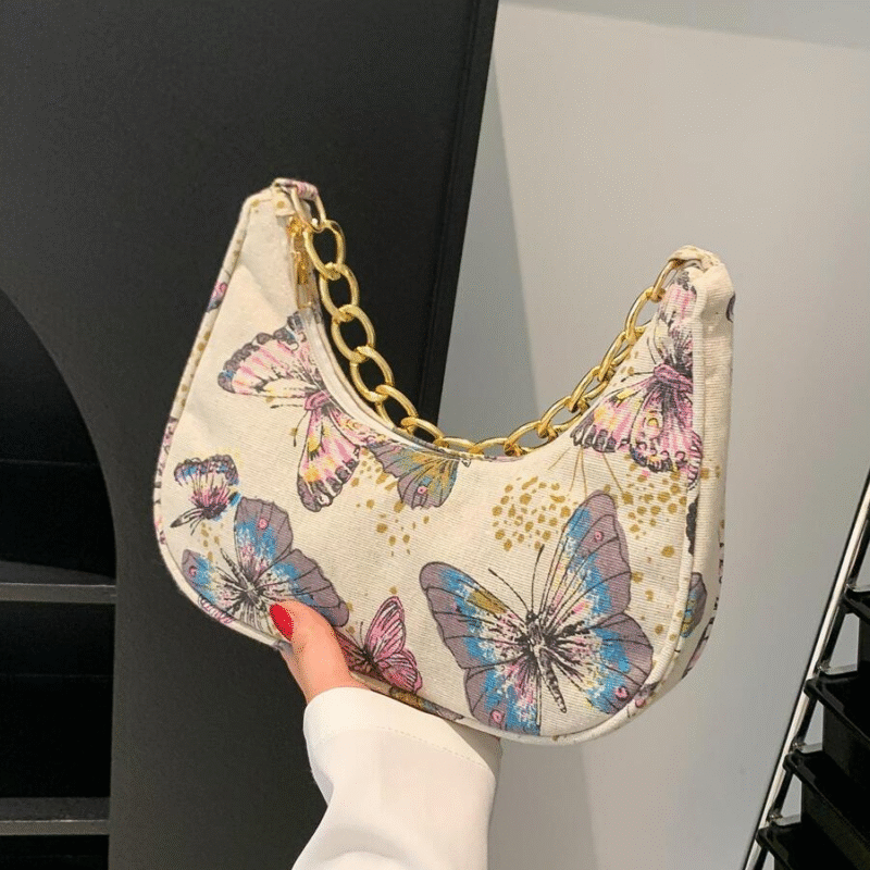 Bolso de mano con correa de cadena con estampado...